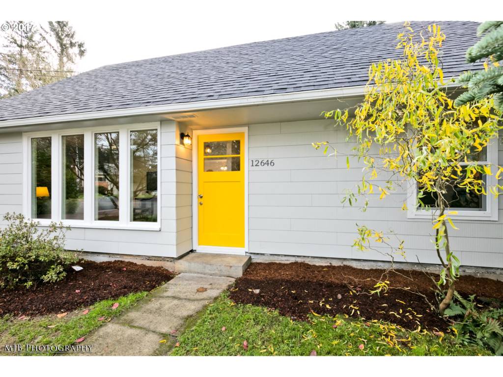 yellow front door of charming Mill Park home 