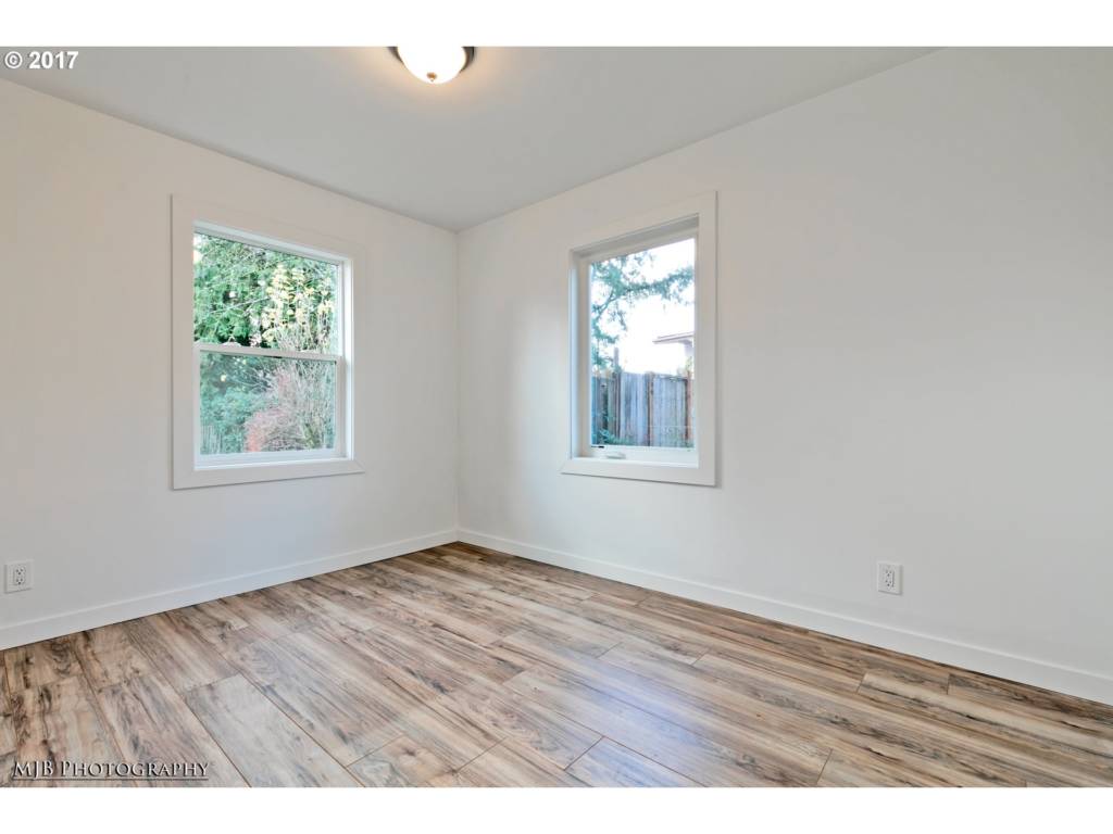 guest bedroom with hardwood floors