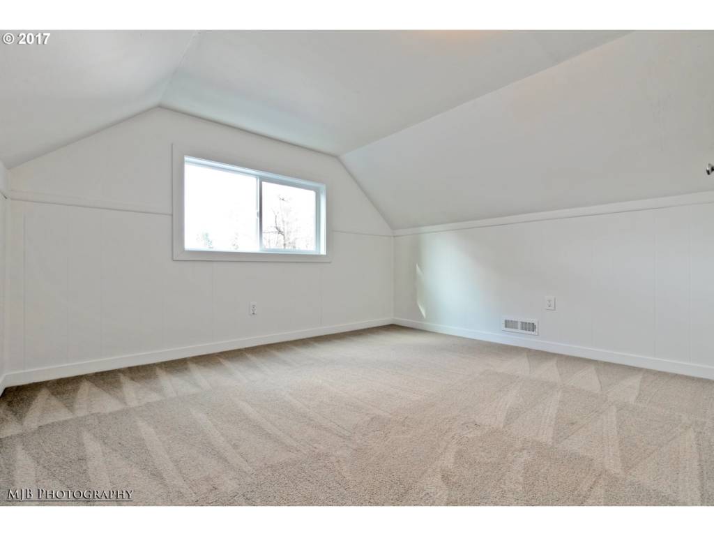 upstairs bedroom with new carpet and paint