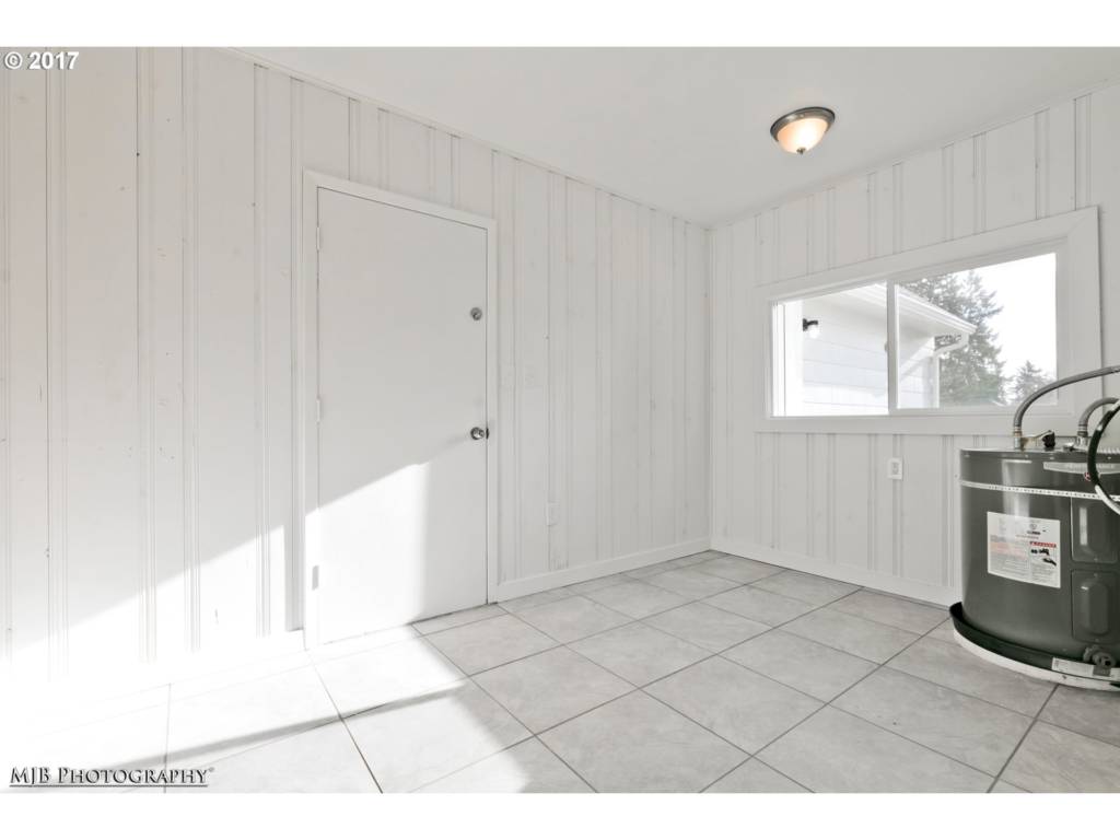 dedicated laundry room with new tile